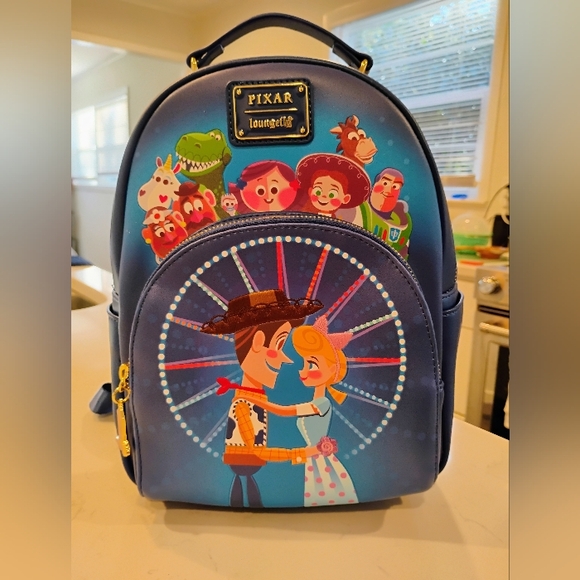 Loungefly Handbags - Loungefly Pixar Toy Story Movie Moment Mini Backpack